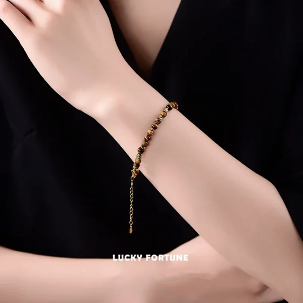 Wrist Wearing Tiger Eye Bracelet in Natural Light