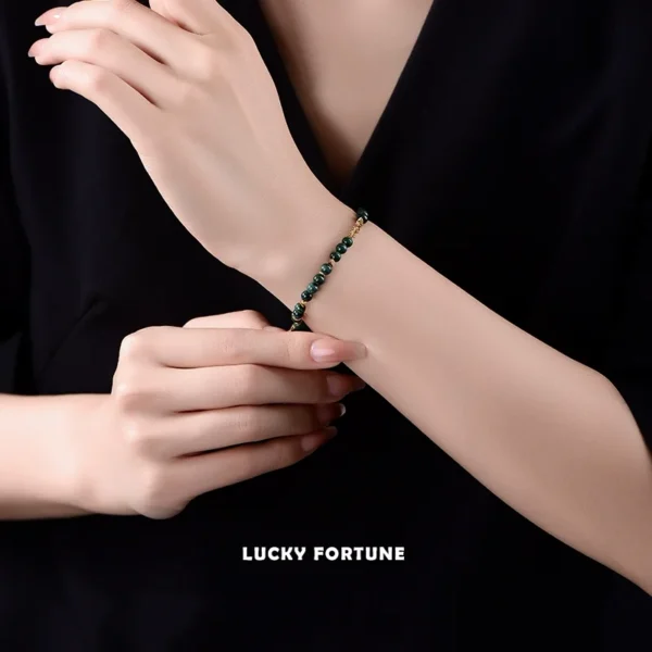 Woman Wearing Malachite Bracelet with Botanical Background
