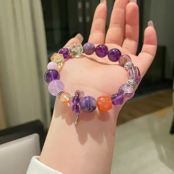 Woman wearing amethyst and citrine courage energy bracelet