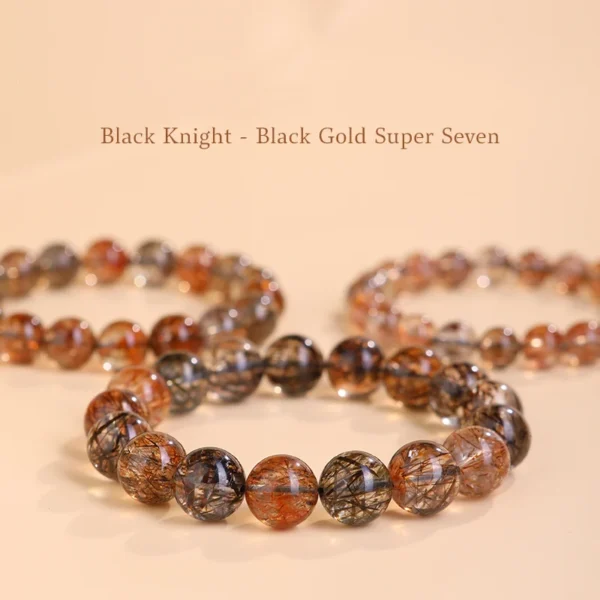 Black Gold Super Seven bracelets arranged on peach-toned background with text