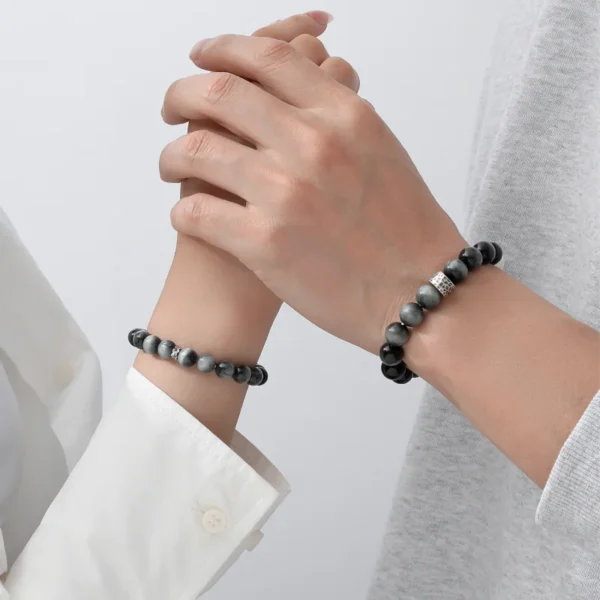 Yin Radiance bracelets on hands in gentle embrace