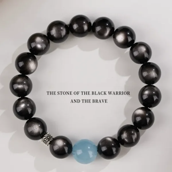 top view of silver obsidian bracelet with aquamarine center