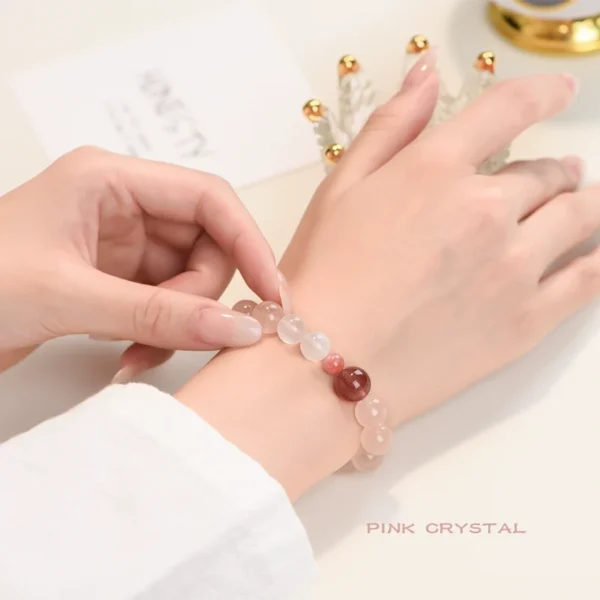 Woman wearing pink crystal bracelet with warm soft light