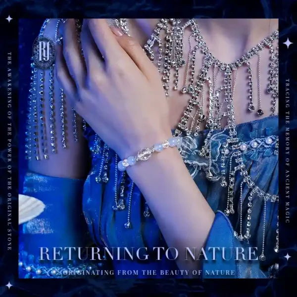Elegant woman wearing blue chalcedony and quartz bracelet with silver and zircon beads