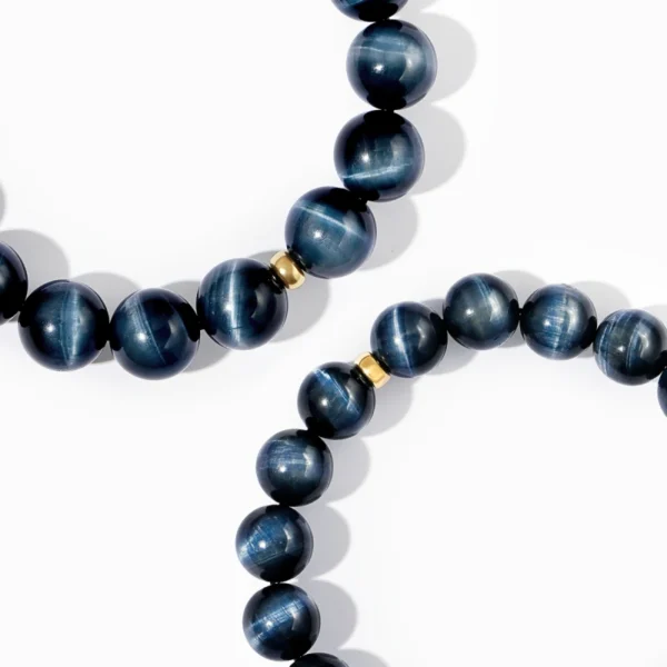 Close-up of Blue Tiger Eye beads with golden spacer