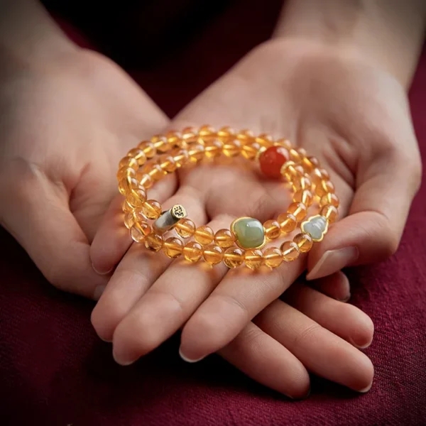 Citrine bracelet design featuring Hetian Jade, Zodiac Protector charm, and energy beads for wealth