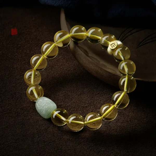 Citrine & Hetian Jade Zodiac Guardian Bracelet showcasing vibrant yellow crystals and a carved Hetian Jade charm