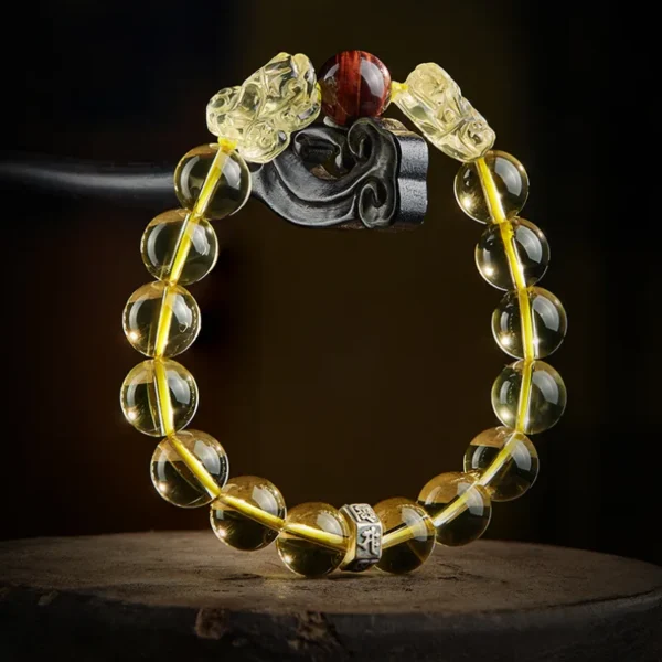 Citrine bracelet featuring PiXiu charms, Tiger’s Eye bead, and Zodiac Protector charm