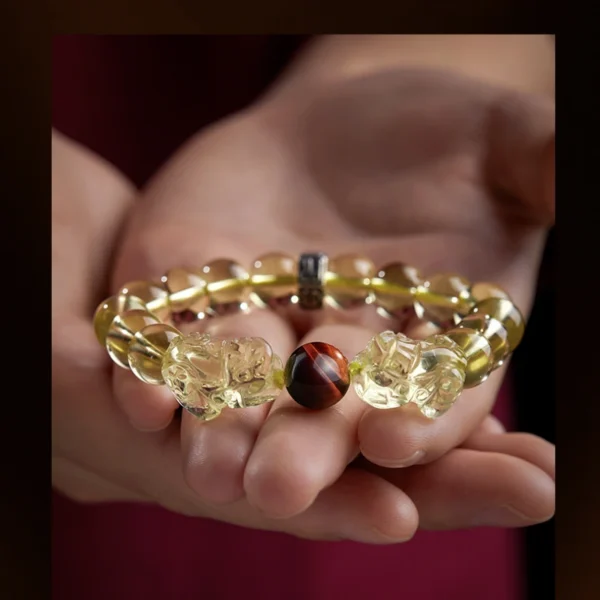 Citrine bracelet with Tiger’s Eye bead, PiXiu carvings, and Zodiac Protector charm for prosperity