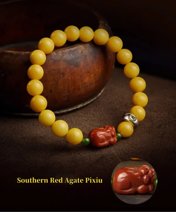 Southern red agate Pixiu on beeswax amber bracelet close-up