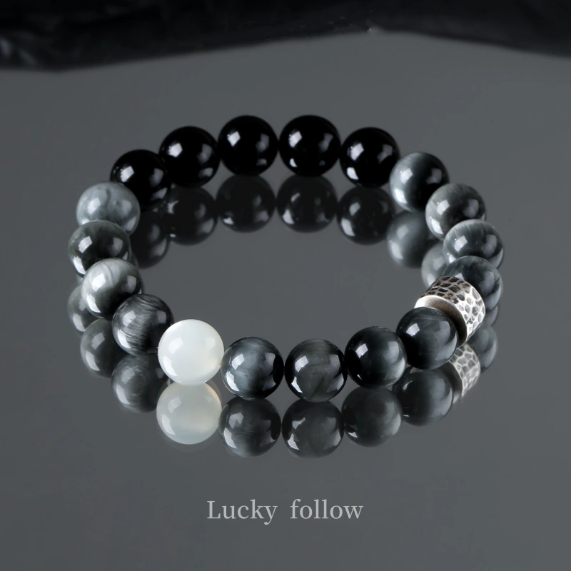 Yin Radiance bracelet close-up featuring Hawk’s Eye and Moonstone