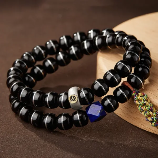 Double-wrapped zodiac bracelet with colorful tassel