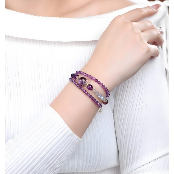 Amethyst and moonstone triple-wrap bracelet on wrist