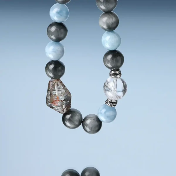 Close-up of Super Seven crystal and Aquamarine beads