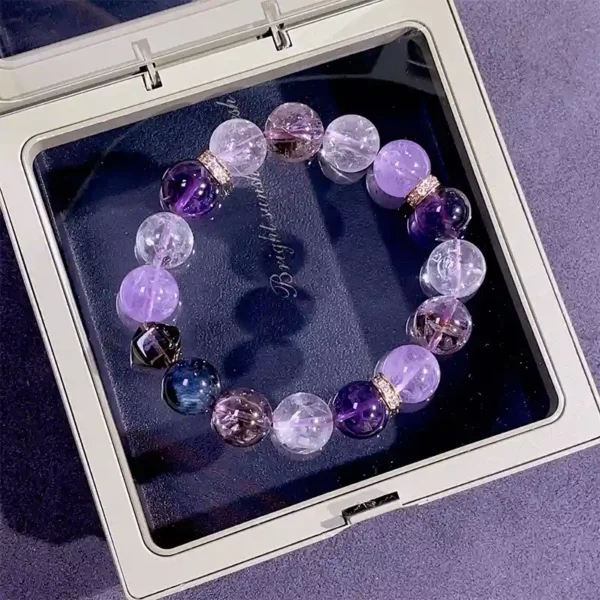 Courage energy bracelet with amethyst, smoky quartz, and blue tiger eye displayed in a jewelry box
