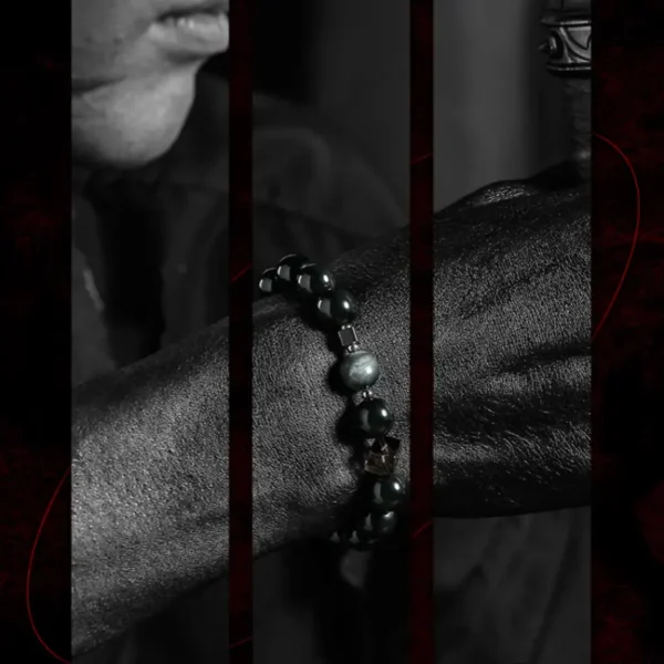 Close-up of GUXI bracelet on wrist with hawk’s eye stone