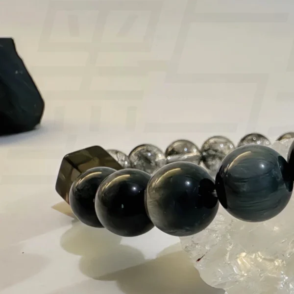 Close-Up View of Green Phantom and Black Hair Quartz Bracelet Beads