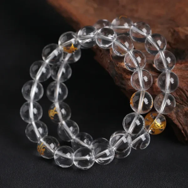 Dual-wrap clear quartz bracelet showcasing engraved Chinese zodiac signs
