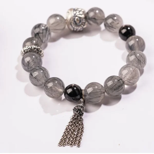 Black rutilated quartz crystal bracelet with silver chain tassel