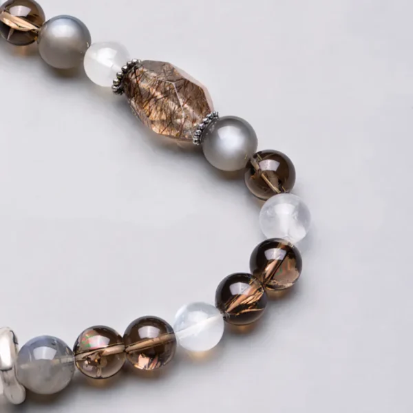 Rutilated Quartz and silver bead detail on energy bracelet
