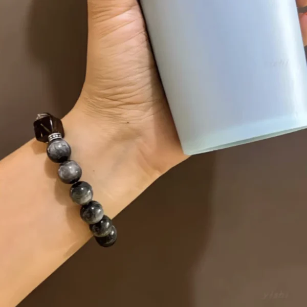 Woman Wearing Black Rutilated Quartz Feng Shui Bracelet on Wrist