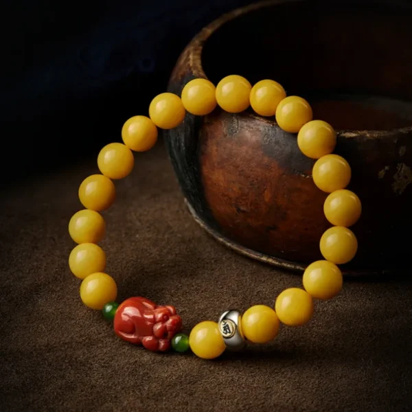 Lucky beeswax amber bracelet with red agate Pixiu symbol