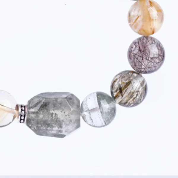 Close-up of left side beads: gold and black rutile quartz