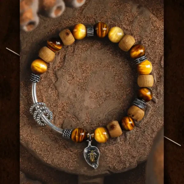 Top view of GUXI men's tiger eye wood bracelet with insect charm