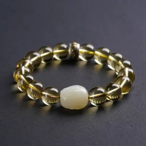 Citrine wealth bracelet with jade Pixiu in natural light