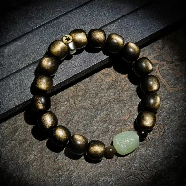 Zodiac bracelet with Golden Obsidian beads and a green Hetian Jade Buddha charm