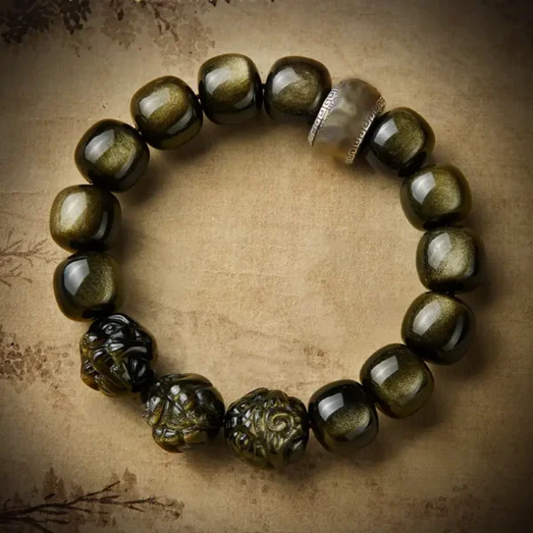 Golden Obsidian bracelet with triple zodiac animal charms and mantra bead for wealth and protection