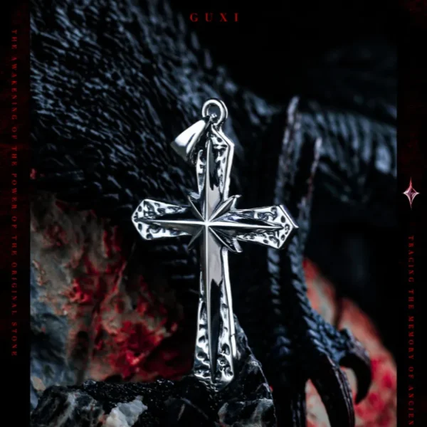 Gothic silver cross necklace displayed with dragon claw in background