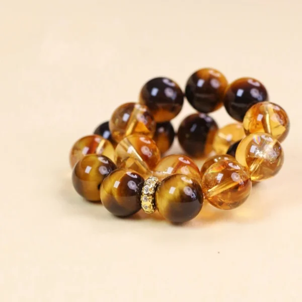 Earth element crystal bracelet stacked with golden energy stones