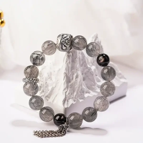 Courage energy crystal bracelet featuring black rutilated quartz and silver details