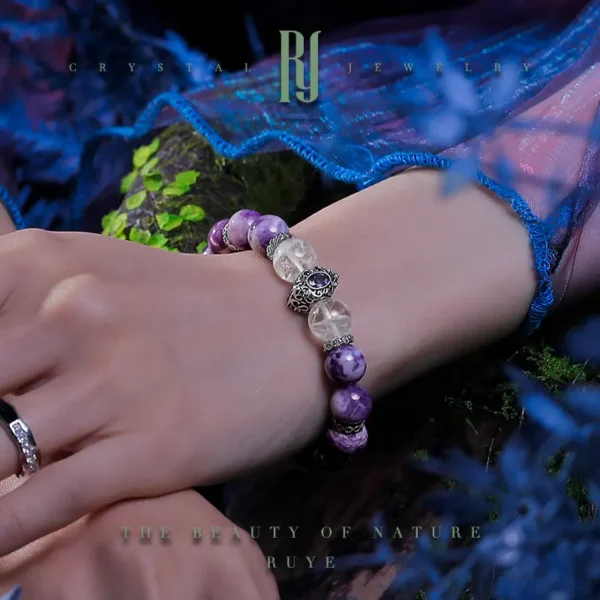 Close-up of wrist wearing purple jade and phantom crystal energy bracelet