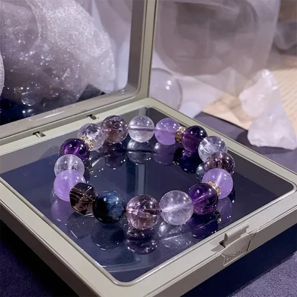 Amethyst and smoky quartz gemstone bracelet photographed in jewelry case with soft lighting