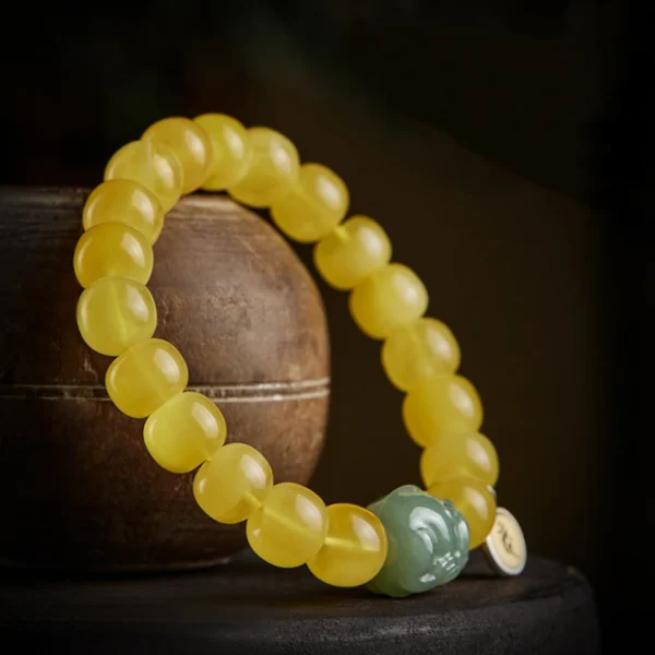 Hetian Jade Pixiu charm and zodiac guardian bead on Feng Shui bracelet