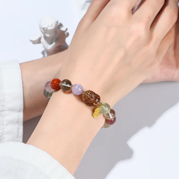 Hand wearing multicolor crystal Pixiu bracelet