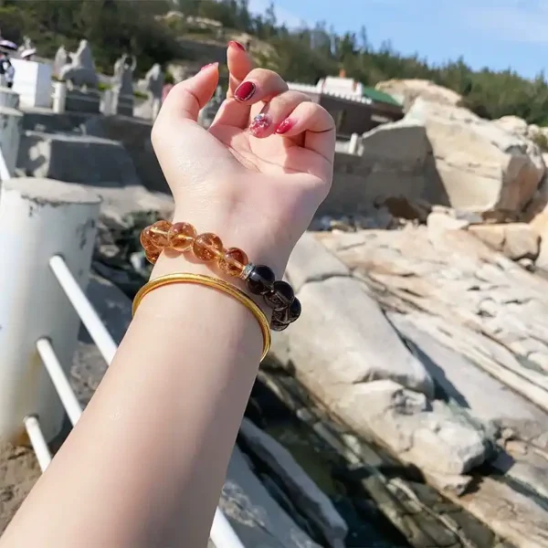 Bracelet worn with gold bangle outdoors