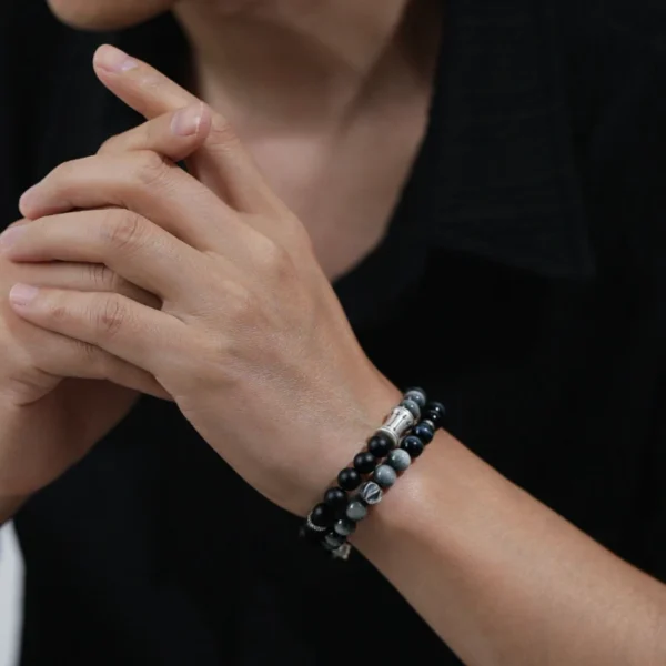 Man Wearing Blue and Black Healing Crystal Bracelet