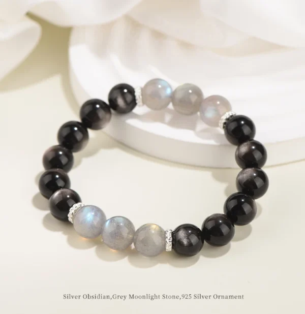 Moonstone and obsidian bracelet on soft white props