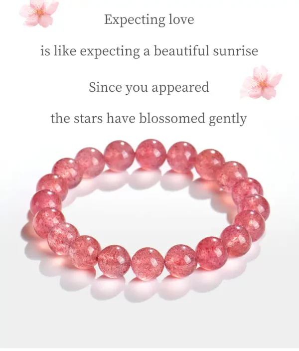 trawberry quartz bracelet close-up on white surface
