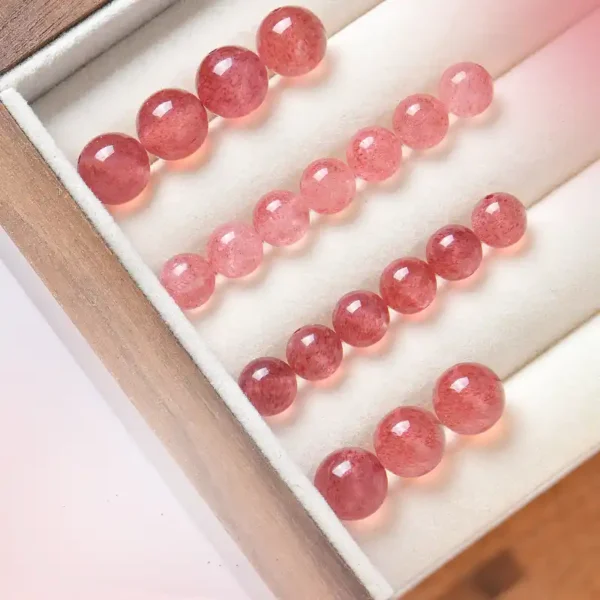 Various sizes of strawberry quartz beads