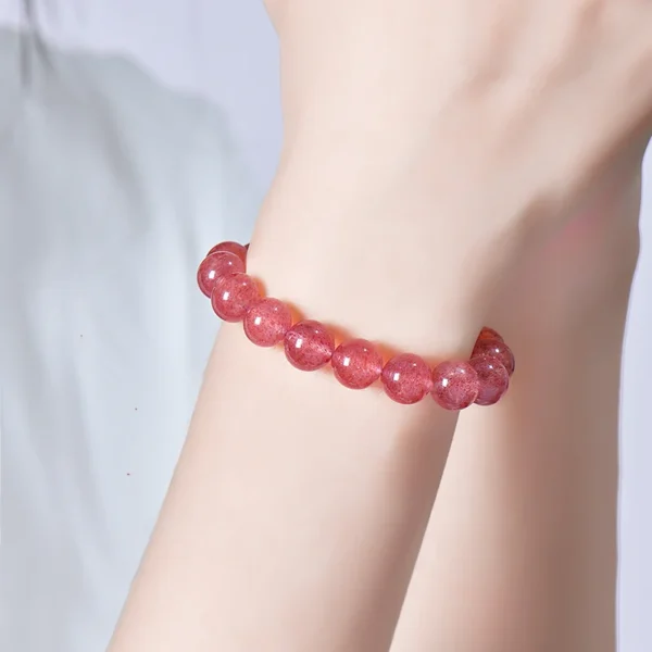 Strawberry quartz bracelet on wrist