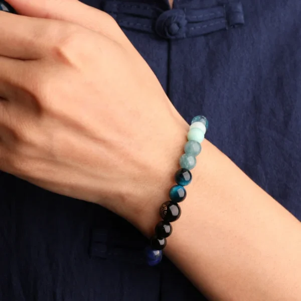 Water Element bracelet with Balance charm on natural background