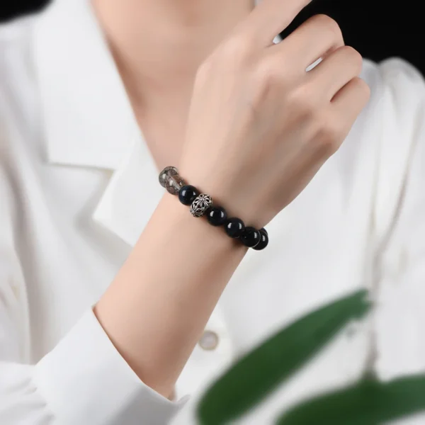 Woman wearing silver obsidian and eagle eye bracelet