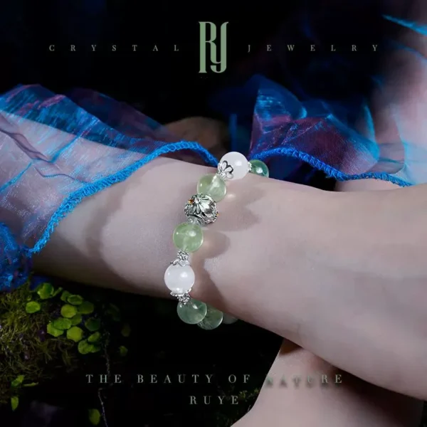 Model holding White Ghost and Prehnite bracelet from RUYE