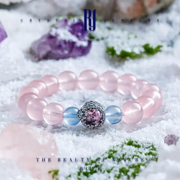 High-end handmade crystal bracelet with rose quartz and aquamarine beads, featuring a 925 silver floral charm