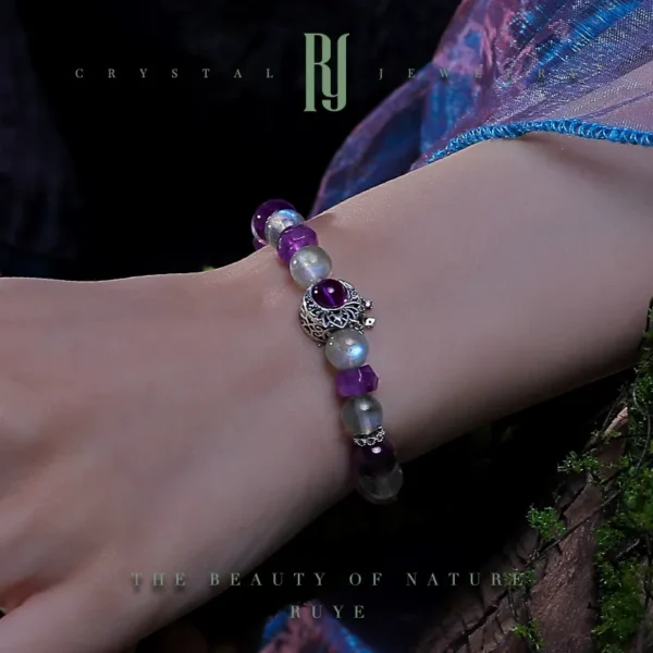 Handmade moonstone and amethyst bracelet worn on wrist – silver charm bracelet