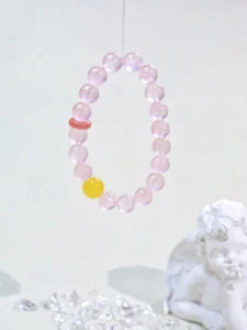 Radiant Love - Love energy crystal bracelet with rose quartz, beeswax and red agate on white background